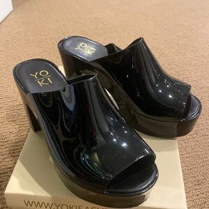 Platform Mules in black.